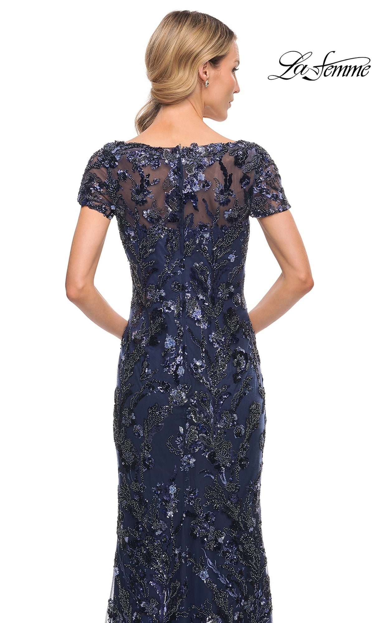 Back view of a navy blue short-sleeved La Femme 30375 formal dress featuring sequin floral embroidery, suitable for evening weddings.